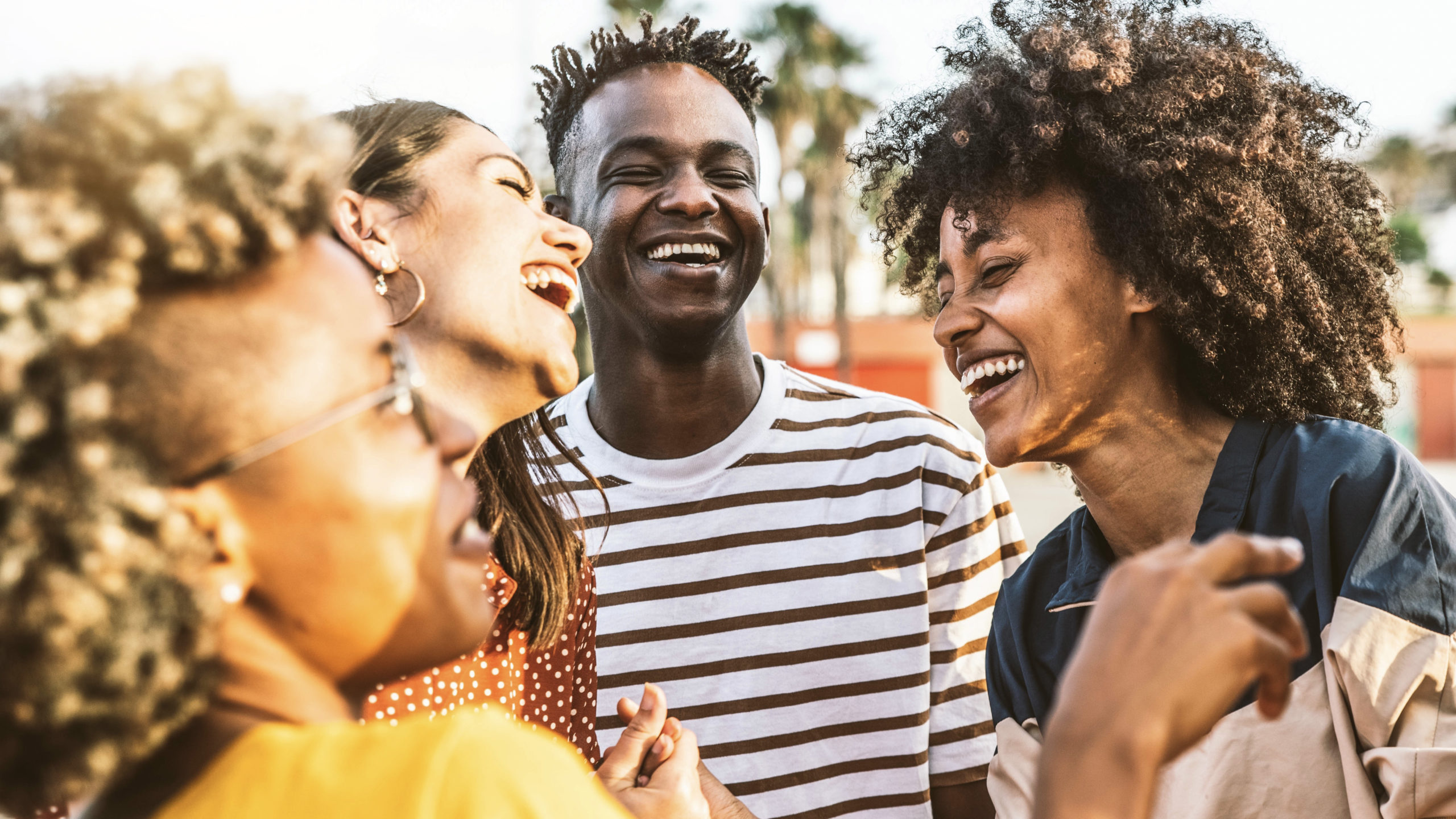 Young happy people laughing together - Multiracial friends group