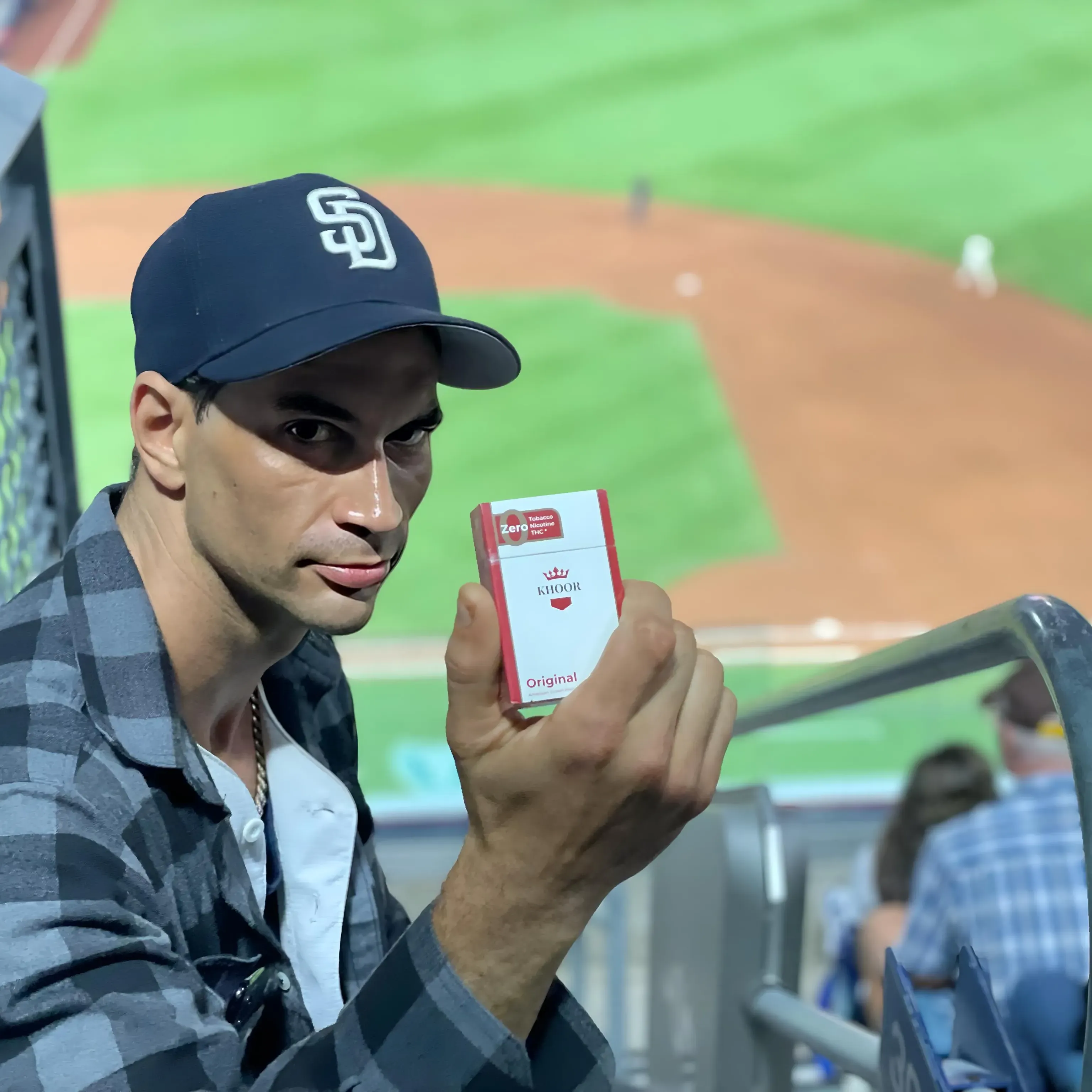 Person enjoying KHOOR nicotine-free cigarettes in San Diego